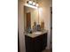Bathroom with granite countertop, dark wood cabinet and ample storage at 237 Arborview Dr, Mcdonough, GA 30252