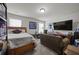 This bedroom features a full bed, a TV, a couch, a desk, and shelving, creating a personalized and functional space at 237 Arborview Dr, Mcdonough, GA 30252
