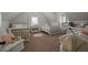 This bedroom features two twin beds with bedding and furniture, a desk, a chair, and modern fixtures, creating a stylish space at 237 Arborview Dr, Mcdonough, GA 30252