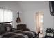Bedroom featuring a checkered bedspread, an acoustic guitar, and an ensuite bathroom at 237 Arborview Dr, Mcdonough, GA 30252