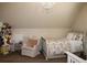 Charming bedroom features cozy chair, chandelier, ample natural light and twin bed at 237 Arborview Dr, Mcdonough, GA 30252