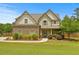 Charming two-story home featuring brick and siding accents, a well-manicured lawn, and a welcoming front porch at 237 Arborview Dr, Mcdonough, GA 30252