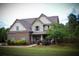 Inviting two-story home featuring a beautifully maintained lawn and covered front porch at 237 Arborview Dr, Mcdonough, GA 30252