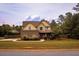 Charming two-story home with manicured lawn and welcoming front entrance at 237 Arborview Dr, Mcdonough, GA 30252