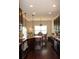 Open kitchen layout with stainless steel appliances and a dining area at 237 Arborview Dr, Mcdonough, GA 30252