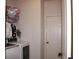 Bright laundry room with modern appliances, storage shelves and a door to outside at 237 Arborview Dr, Mcdonough, GA 30252