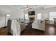 Comfortable living room with coffered ceilings, fireplace, and hardwood floors providing a relaxing atmosphere at 237 Arborview Dr, Mcdonough, GA 30252