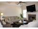 Cozy living room with a fireplace, large TV, and comfortable seating at 237 Arborview Dr, Mcdonough, GA 30252