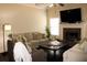 Comfortable living room with fireplace, large TV, and ample seating on plush sofas at 237 Arborview Dr, Mcdonough, GA 30252