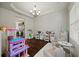 Well-lit playroom featuring hardwood floors, custom shelving, and decorative lighting, perfect for  at 237 Arborview Dr, Mcdonough, GA 30252