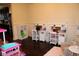 Bright playroom featuring two desks with shelves for books and toys at 237 Arborview Dr, Mcdonough, GA 30252