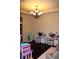 Spacious playroom with chandelier, homework desks and ample storage at 237 Arborview Dr, Mcdonough, GA 30252
