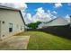 Spacious backyard with a well-maintained lawn and wooden fence, perfect for outdoor activities and privacy at 2671 Calvary Dr, Hampton, GA 30228