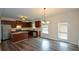 Modern kitchen with stainless steel appliances, granite countertops, and a breakfast bar overlooking the dining area at 2671 Calvary Dr, Hampton, GA 30228