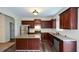 Modern kitchen with granite countertops, stainless steel appliances, and an island at 2671 Calvary Dr, Hampton, GA 30228