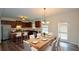 Eat-in kitchen featuring stainless steel appliances, granite countertops, and a stylish dining area at 2671 Calvary Dr, Hampton, GA 30228