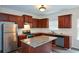 Bright kitchen features granite counters, stainless steel appliances, and ample cabinet space at 2671 Calvary Dr, Hampton, GA 30228