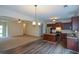 Open-concept kitchen featuring granite countertops, island, and stainless steel appliances at 2671 Calvary Dr, Hampton, GA 30228