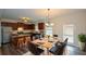 Well-appointed kitchen and dining area featuring stainless steel appliances and hardwood flooring at 2671 Calvary Dr, Hampton, GA 30228