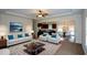 Inviting living room with neutral tones, ceiling fan, and an open floor plan into the kitchen and dining area at 2671 Calvary Dr, Hampton, GA 30228