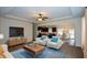 Cozy living room with stylish decor, ceiling fan, and an open layout connecting to the kitchen and dining space at 2671 Calvary Dr, Hampton, GA 30228
