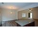 Open living space with hardwood floors, an island and an adjoining dining area at 2671 Calvary Dr, Hampton, GA 30228