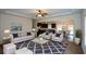 Stylishly furnished living room leading into an open kitchen and dining area, creating a welcoming space at 2671 Calvary Dr, Hampton, GA 30228