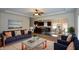 Open-concept living room seamlessly connects to a modern kitchen and dining area, ideal for entertaining at 2671 Calvary Dr, Hampton, GA 30228