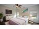 Elegant main bedroom with tray ceiling, stylish decor, and abundant natural light creating a peaceful retreat at 2671 Calvary Dr, Hampton, GA 30228
