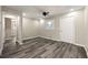 Well-lit bedroom featuring gray flooring, neutral paint, a ceiling fan, and a spacious closet at 2968 Cleburne Pkwy, Powder Springs, GA 30127
