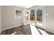 Bedroom features vinyl floors, a bright window, and double doors to the outdoor deck at 2968 Cleburne Pkwy, Powder Springs, GA 30127