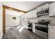 Modern kitchen with white cabinetry, granite countertops, and stainless steel appliances at 2968 Cleburne Pkwy, Powder Springs, GA 30127