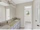 Bathroom featuring double sink with granite countertop, a large mirror and neutral paint at 4468 Windsor Oaks Dr, Marietta, GA 30066