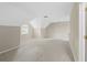 Neutral bedroom with light colored walls, carpet, and sloped ceilings with arched window letting in natural light at 4468 Windsor Oaks Dr, Marietta, GA 30066