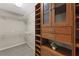 Custom designed walk-in closet with built-in storage cabinets and adjustable shelving at 4468 Windsor Oaks Dr, Marietta, GA 30066