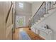 Bright foyer featuring a hardwood floor and elegant staircase with black metal railings at 4468 Windsor Oaks Dr, Marietta, GA 30066