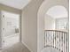 Hallway area featuring an arched entryway, carpeted floors, and views of other rooms at 4468 Windsor Oaks Dr, Marietta, GA 30066