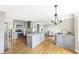 Modern kitchen featuring stainless steel appliances, an island, and hardwood floors at 4468 Windsor Oaks Dr, Marietta, GA 30066