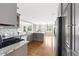 Bright kitchen featuring stainless steel appliances, granite countertops, and hardwood floors at 4468 Windsor Oaks Dr, Marietta, GA 30066