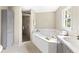 Well-lit main bathroom featuring a corner soaking tub, walk-in shower, and gray-toned vanity at 4468 Windsor Oaks Dr, Marietta, GA 30066