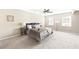 Calm main bedroom featuring carpeted floors, two large windows, and neutral-colored decor at 4468 Windsor Oaks Dr, Marietta, GA 30066