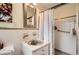 The bathroom has tile flooring and a shower with a glass door at 5478 Janice Ln, Stone Mountain, GA 30087
