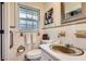 Bathroom with ceramic tile, decorative art, and a sink with vanity at 5478 Janice Ln, Stone Mountain, GA 30087