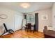 Cozy bedroom with desk and hardwood floors at 5478 Janice Ln, Stone Mountain, GA 30087