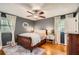 Bedroom with hardwood floors, neutral walls, and abundant natural light at 5478 Janice Ln, Stone Mountain, GA 30087