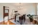 Cozy dining room featuring a stylish rug and view into the adjacent kitchen area at 5478 Janice Ln, Stone Mountain, GA 30087