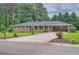 Lovely brick home with a manicured front lawn, complemented by mature trees and inviting curb appeal at 5478 Janice Ln, Stone Mountain, GA 30087