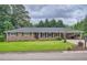 Charming brick home featuring a well-maintained lawn and inviting curb appeal at 5478 Janice Ln, Stone Mountain, GA 30087