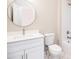 Bathroom with vanity, round mirror, toilet, and tub/shower combo at 1150 Sweet Mia Ln, Powder Springs, GA 30127