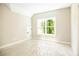 Bright bedroom features a large window and fresh, neutral paint at 1150 Sweet Mia Ln, Powder Springs, GA 30127